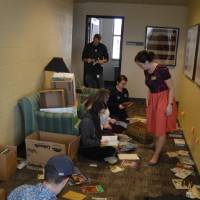 Alumni donate time to sort books